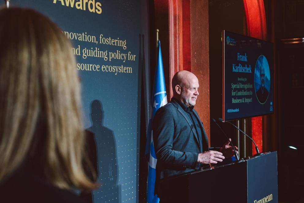 Photo taken at EOSA Awards 2026: Frank Karlitschek gives a speech for receiving the European Open Source Award for Business & Impact award