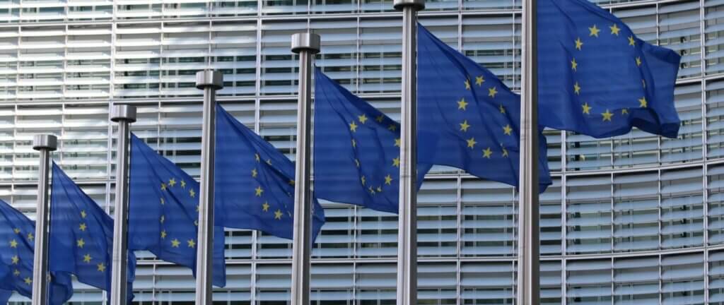 Series of EU flags in front of EU parliament